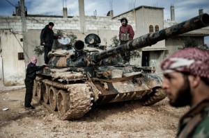 A_Free_Syrian_Army_member_prepares_to_fight_with_a_tank