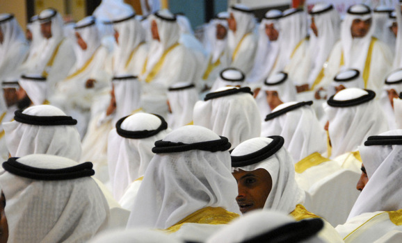 Grooms take part in a mass wedding ceremony in Tabuk