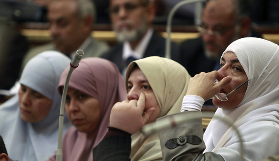 Female Members of Parliament attend a parliament session in Cairo
