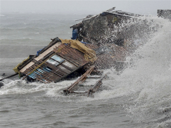 Thousands struggle and fail to flee Philippines as second tropical system makes landfall