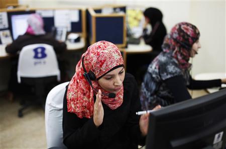 A woman from the Bedouin community works at a call centre housed in a mosque in Hura, southern Israel