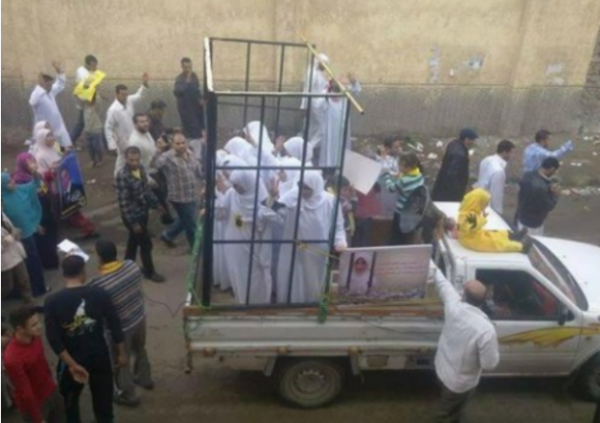This picture is circulated on the internet as being a slave market in Mosul, Iraq. In fact it was an anti-government protest in Egypt. ( See: http://legalinsurrection.com/2014/08/no-this-is-not-a-photo-of-women-being-sold-in-mosul/)
