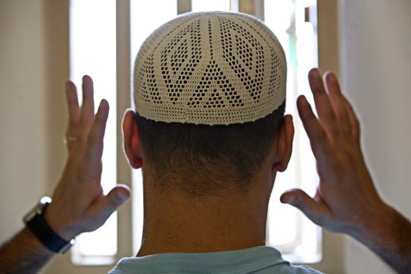 A Muslim prisoner prays in his cell at Wandsworth prison. HMP Wandsworth in South West London was built in 1851 and is one of the largest prisons in Western Europe. It has a capacity of 1456 prisoners.