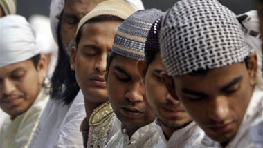 Indian Muslims pray during Eid-al-Adha in Kolkata, India, Monday, Nov. 7, 2011. Muslims in the country celebrate Eid-al-Adha, or the Feast of the Sacrifice, by slaughtering sheep, goats and cows. (AP Photo/Bikas Das)