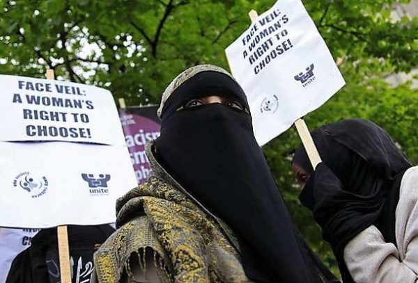 A demonstrator wears a niqab during a protest outside the French embassy in London April 11, 2011. France's ban on full face veils, a first in Europe, went into force today, exposing anyone who wears the Muslim niqab or burqa in public to fines of 150 euros ($216) and lessons in French citizenship. REUTERS/Stefan Wermuth (BRITAIN - Tags: POLITICS RELIGION CIVIL UNREST HEADSHOT)