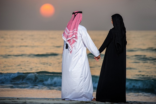 Arab-couple-at-the-beach-watching-the-sunset