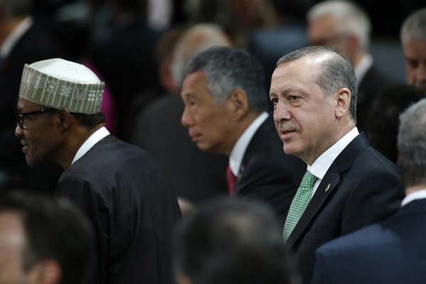 Nigeria's President Muhammadu Buhari, Singapore's Prime Minister Lee Hsien Loong and Turkey's President Tayyip Erdogan (L-R) attend the first plenary session of the Nuclear Security Summit in Washington April 1, 2016. REUTERS/Jonathan Ernst