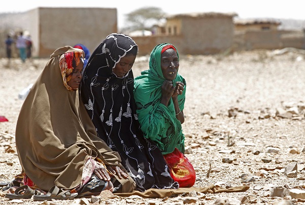 Women pray as they wait for assistance at Hariirad town of Awdal region, Somaliland. REUTERS/Feisal Omar