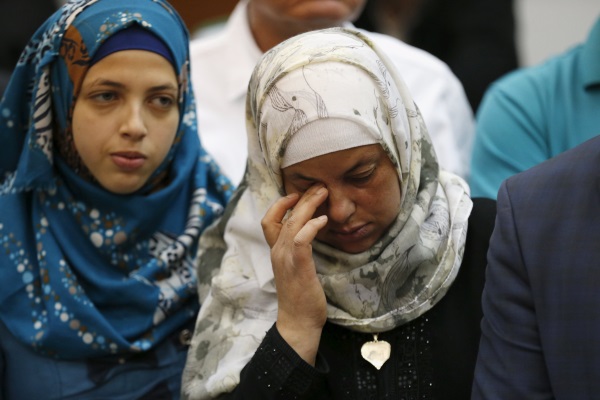 Mother (R) of 16-year-old Palestinian teenager Mohammed Abu Khudair, who was killed in Jerusalem in 2014, reacts after a ruling against one of her son's murderers, Yosef Haim Ben-David, (not pictured) at Jerusalem's District Court April 19, 2016. REUTERS/Ammar Awad