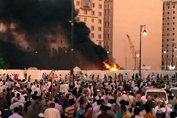 Muslim worshippers gather after a suicide bomber detonated a device near the security headquarters of the Prophet's Mosque in Medina, Saudi Arabia, July 4, 2016. REUTERS/Handout