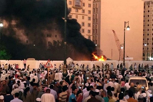 Muslim worshippers gather after a suicide bomber detonated a device near the security headquarters of the Prophet's Mosque in Medina, Saudi Arabia, July 4, 2016. REUTERS/Handout