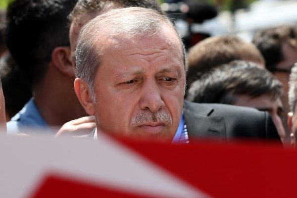 epa05429068 Turkish President Recep Tayyip Erdogan stands next to a coffin of a victim who was killed in a coup attempt on 16 July, during the funeral at Fatih Mosque, in Istanbul, Turkey, 17 July 2016. Turkish Prime Minister Yildirim reportedly said that the Turkish military was involved in an attempted coup d'etat. Turkish President Recep Tayyip Erdogan has denounced the coup attempt as an 'act of treason' and insisted his government remains in charge. Some 104 coup plotters were killed, 90 people - 41 of them police and 47 are civilians - 'fell martrys', after an attempt to bring down the Turkish government, the acting army chief General Umit Dundar said in a televised appearance.  EPA/TOLGA BOZOGLU