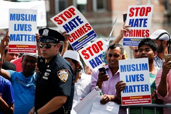 Community members take part in a protest to demand stop hate crime during the funeral service of Imam Maulama Akonjee, and Thara Uddin in Queens. REUTERS/Eduardo Munoz