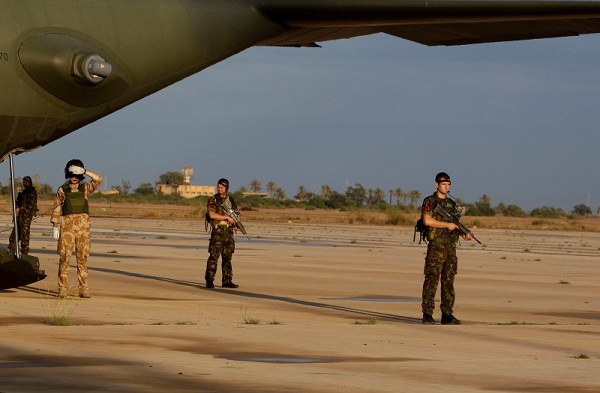 British soldiers stand guard during the visit of defence secretary Liam Fox at Misrata airport 200km (124.2 miles) east of Tripoli in this file October 8, 2011 photo. REUTERS/Suhaib Salem