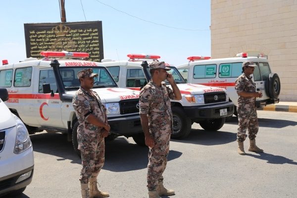 Ranks of the Jordanian army look on as the ambulances are handed over to officials.