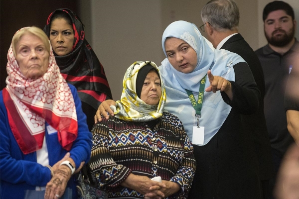 Maria Zocohi, third from left, listens to Spanish translator Somayah Gonzalez during a tour of Anaheim's Islamic Institute of Orange County where the 14th Annual Open Mosque Day was held. (Photo by Cindy Yamanaka, Orange County Register/SCNG)