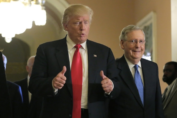 U.S. President-elect Donald Trump (L) gives a thumbs up sign as he walks with Senate Majority Leader Mitch McConnell (R-KY) on Capitol Hill in Washington, U.S., November 10, 2016. REUTERS/Joshua Roberts - RTX2T3F7
